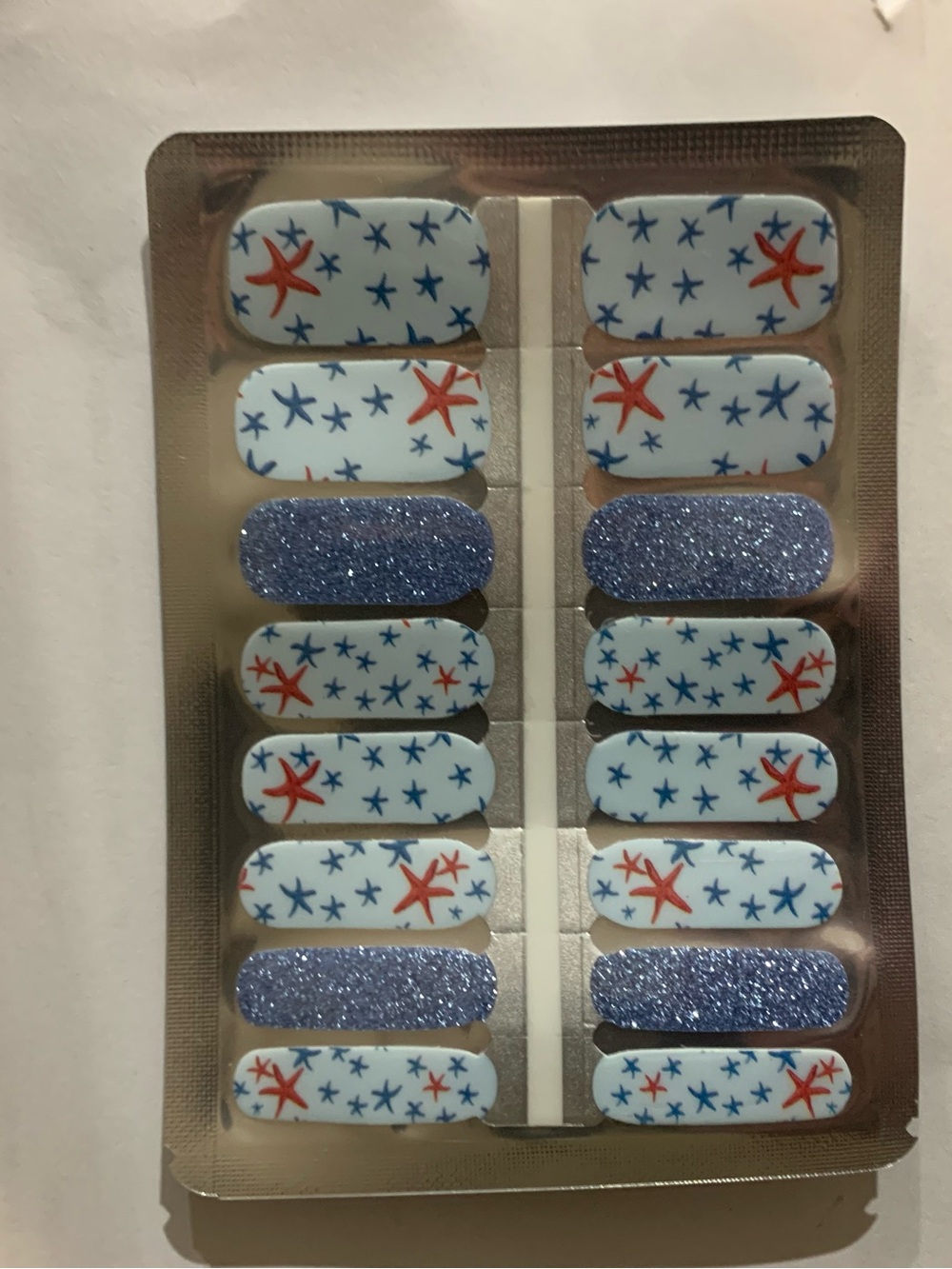 Starfish Pattern Press-On Nail Strips with Blue Glitter Accents